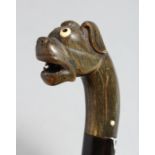A WALKING CANE WITH CARVED RHINO, BULLDOG HANDLE (an eye and some teeth missing).