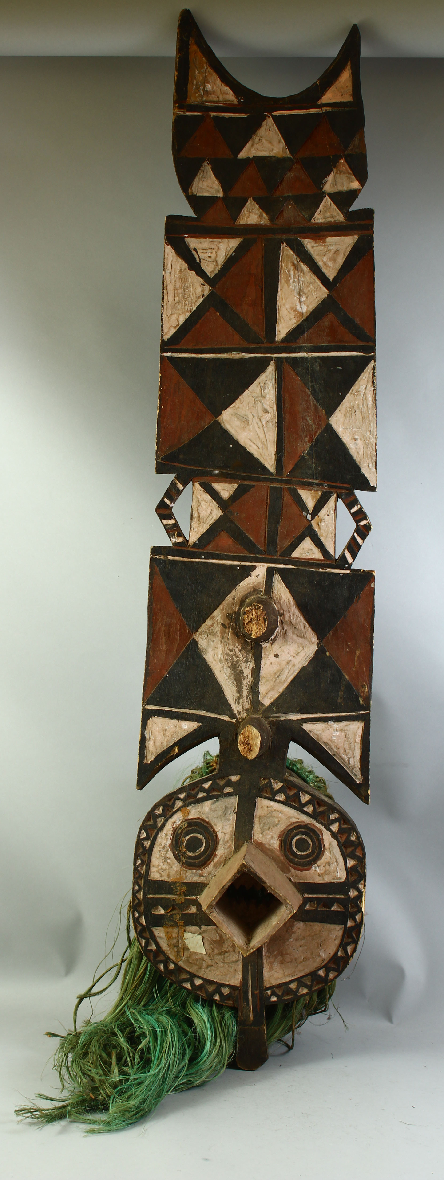 A LARGE PAINTED TRIBAL MASK, 4ft 10" long.