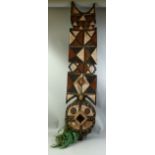 A LARGE PAINTED TRIBAL MASK, 4ft 10" long.