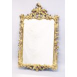 A ROCCOCO STYLE GILT FRAMED PIER MIRROR. 3ft 6.5ins high x 2ft 2ins wide.