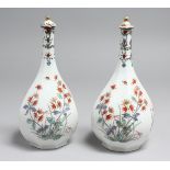 A PAIR OF 18TH CENTURY KAKIEMON OCTAGONAL BOTTLE VASES AND COVERS. 8ins high.