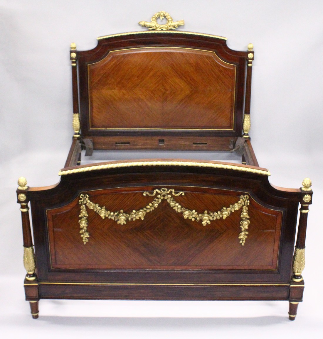 A GOOD LATE 19TH CENTURY FRENCH LOUIS XVI STYLE KINGWOOD MAHOGANY AND ORMOLU BED FRAME, the