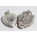 TWO SILVER HEAVY SHAPED PERFUME BOTTLES.