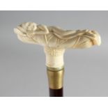 A WALKING STICK with carved bone handle of a nude
