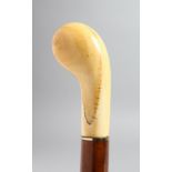 A WALKING STICK WITH CARVED IVORY HANDLE.