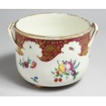 AN 18TH CENTURY WORCESTER ICE PAIL ON FEET painted with fruit and claret cornucopia, "In the