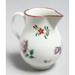 AN 18TH CENTURY BRISTOL JUG painted with a large floral spray and scattered flowers.