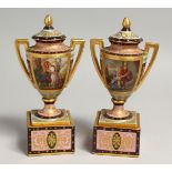 A SUPERB SMALL PAIR OF VIENNA URNS, COVERS AND STANDS rich blue gilt decoration and painted