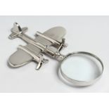 A NOVELTY CHROME PLANE MAGNIFYING GLASS.