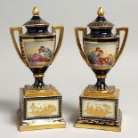 A SUPERB SMALL PAIR OF VIENNA URNS, COVERS AND STANDS rich gilt decoration and painted classical