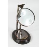A MAGNIFYING GLASS on a stand.