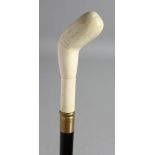 A WALKING STICK with carved bone handle.