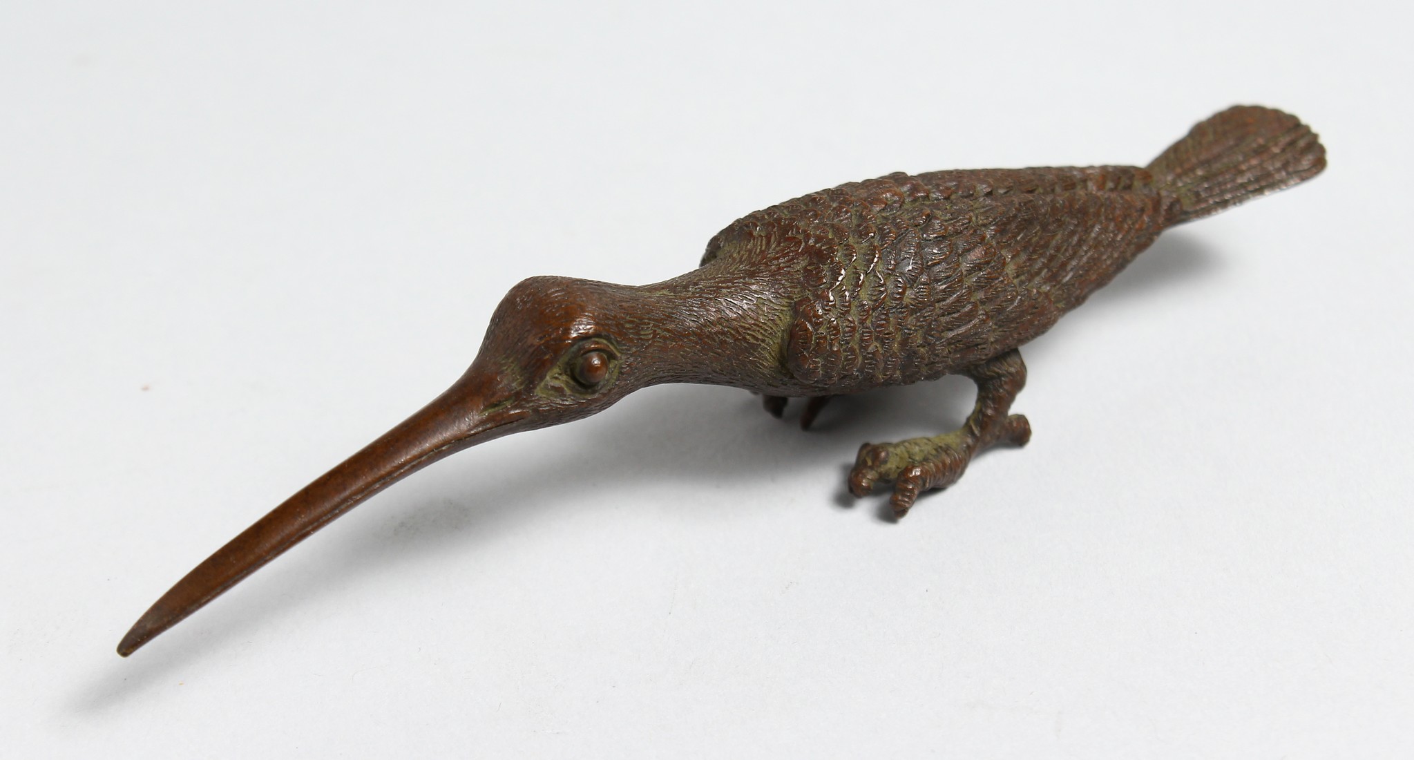 A SMALL JAPANESE BRONZE ARTICULATED BIRD with long beaks, 5ins long.