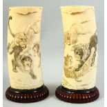 A PAIR OF EARLY 20TH CENTURY JAPANESE IVORY TUSK VASES, depicting fighting lions and tigers, mounted