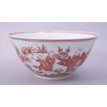 A CHINESE IRON RED AND WHITE PORCELAIN BOWL, the exterior painted with many figures in a garden