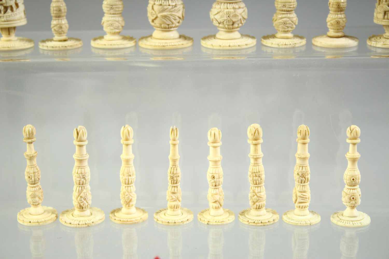 A BURMESE CARVED AND STAINED IVORY CHESS SET, each piece intricately carved, complete, (32 pieces). - Image 3 of 5