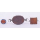 THREE ISLAMIC CARVED AGATE CALLIGRAPHIC SEALS, one inset within carved lapis, the others encased