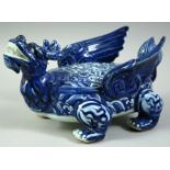 A CHINESE BLUE AND WHITE PORCELAIN MODEL OF DRAGON-LIKE BEAST, the winged creature decorated with