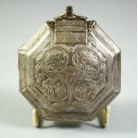 AN ISLAMIC WHITE METAL OCTAGONAL QURAN AMULET BOX, possibly silver, 7.5cm diameter.