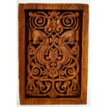 AN ISLAMIC CARVED WOODEN PANEL, with central horse motif, 31.5cm x 21.5cm.