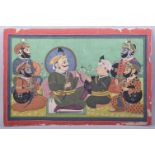 A LARGE INDIAN PAINTING ON PAPER, of a group of male figures participating in a ceremonial ritual in