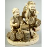 A JAPANESE MEIJI PERIOD CARVED IVORY OKIMONO of two basket sellers, the two figures completely