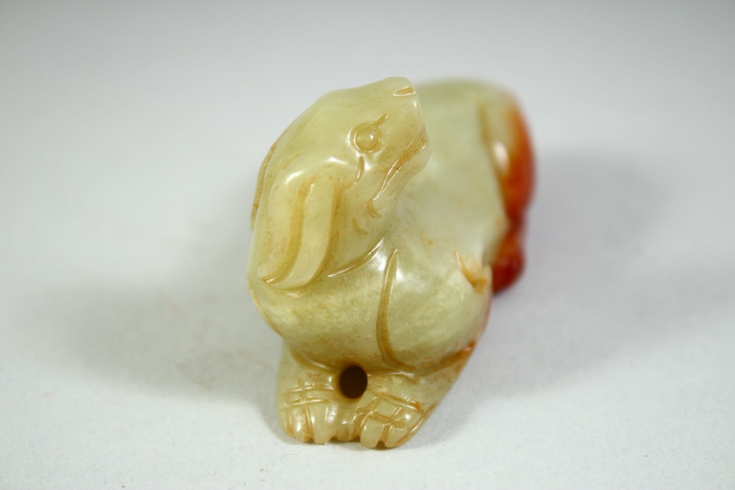 A CHINESE CARVED JADE MODEL OF A RECUMBENT BEAST, 6.5cm long. - Image 2 of 5