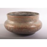 A GOOD ISLAMIC MAMLUK ENGRAVED AND CHASED COPPERED BRONZE BOWL, the rim with a band of calligraphy