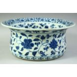 A LARGE CHINESE BLUE AND WHITE PORCELAIN WASHING BASIN, painted all over with bands of foliate