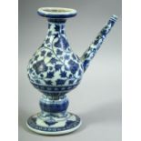 A CHINESE BLUE AND WHITE MING STYLE PORCELAIN WATER DROPPER, painted with floral decoration, the
