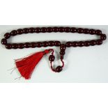 A SET OF CHERRY AMBER / BAKELITE PRAYER BEADS, comprising 36 beads (including toggle) and two