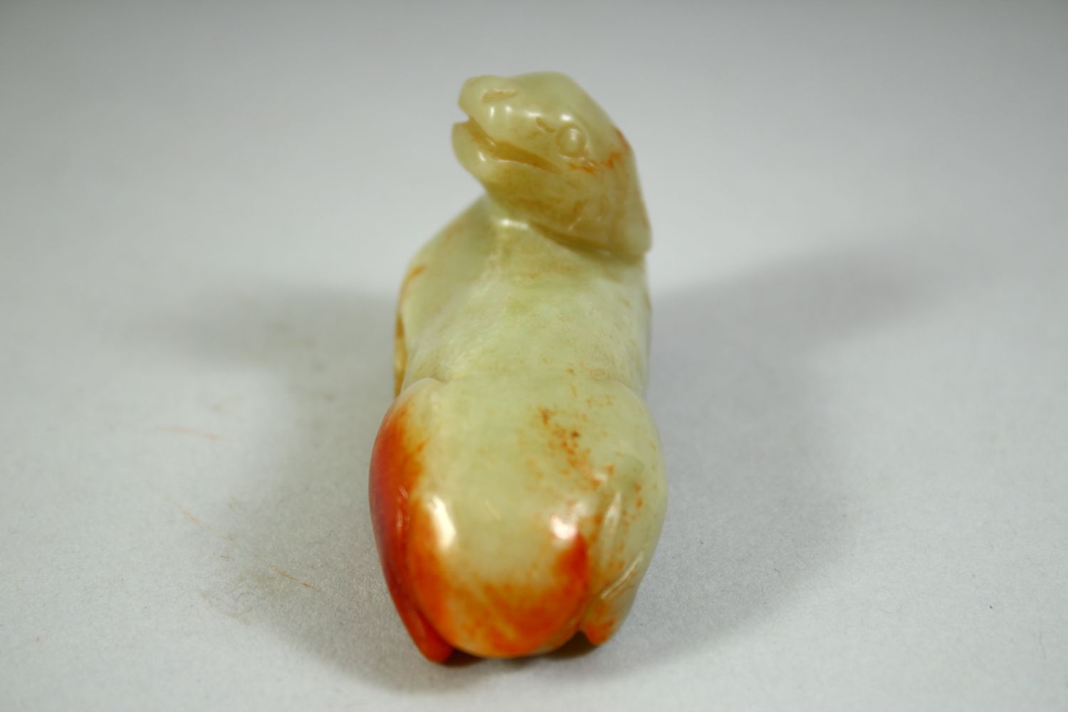 A CHINESE CARVED JADE MODEL OF A RECUMBENT BEAST, 6.5cm long. - Image 4 of 5