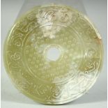 A LARGE CHINESE CARVED NEPHRITE JADE ARCHAIC DISK, 12.5cm.