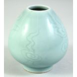 A CHINESE CELADON GLAZE BRUSH POT, the base with six character mark, 9cm high.