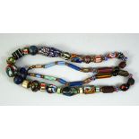 AN ISLAMIC GLASS BEADED NECKLACE, of various styles and forms.