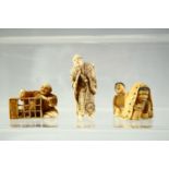 THREE JAPANESE CARVED IVORY NETSUKES, including a standing figure holding a sword, a carpenter and a