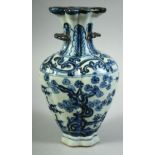 AN UNUSUAL CHINESE BLUE AND WHITE PORCELAIN VASE, 20.5cm high.