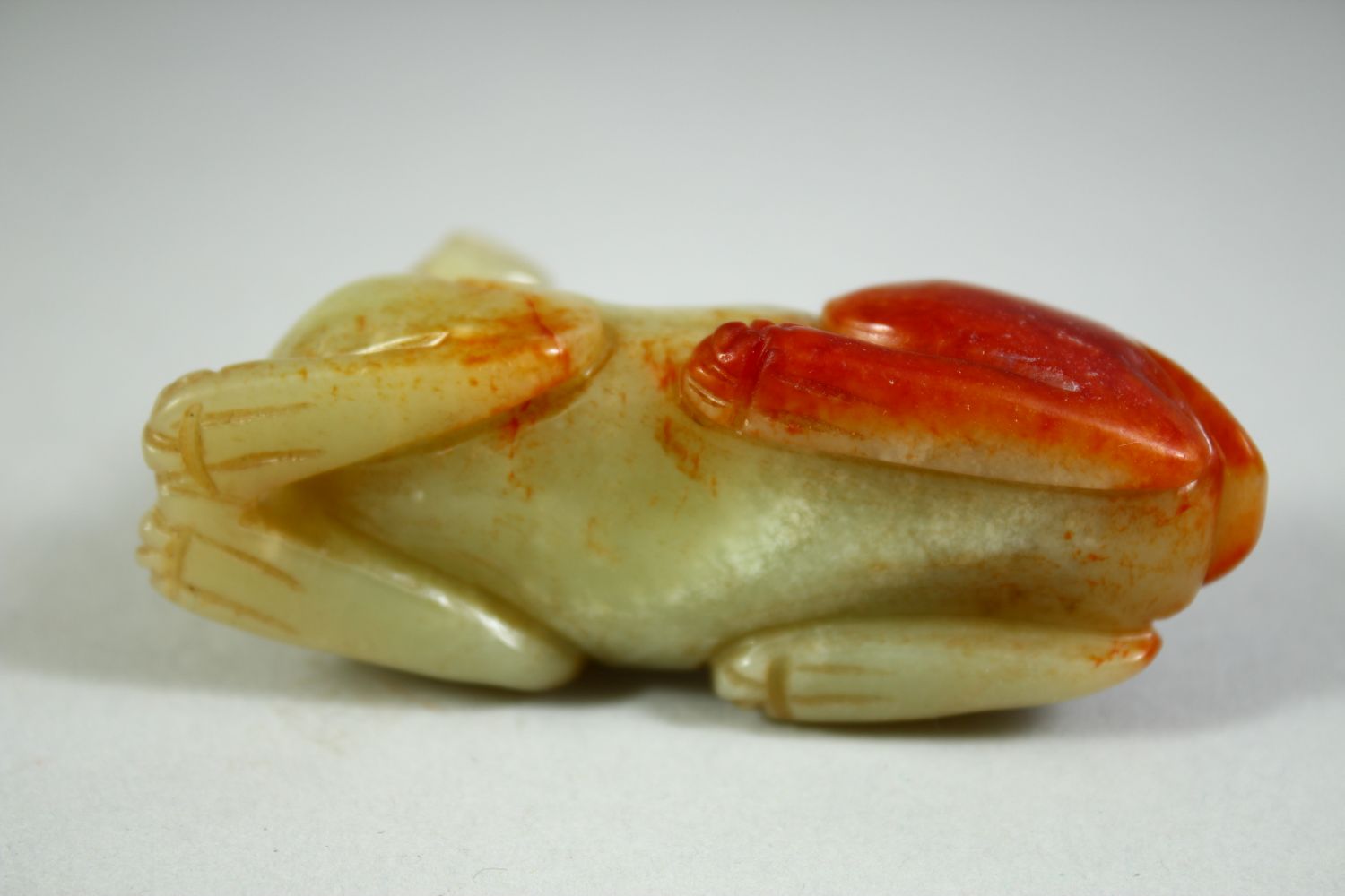 A CHINESE CARVED JADE MODEL OF A RECUMBENT BEAST, 6.5cm long. - Image 5 of 5