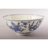 A CHINESE BLUE AND WHITE PORCELAIN BOWL, painted with mythological beasts and intertwined pattern,
