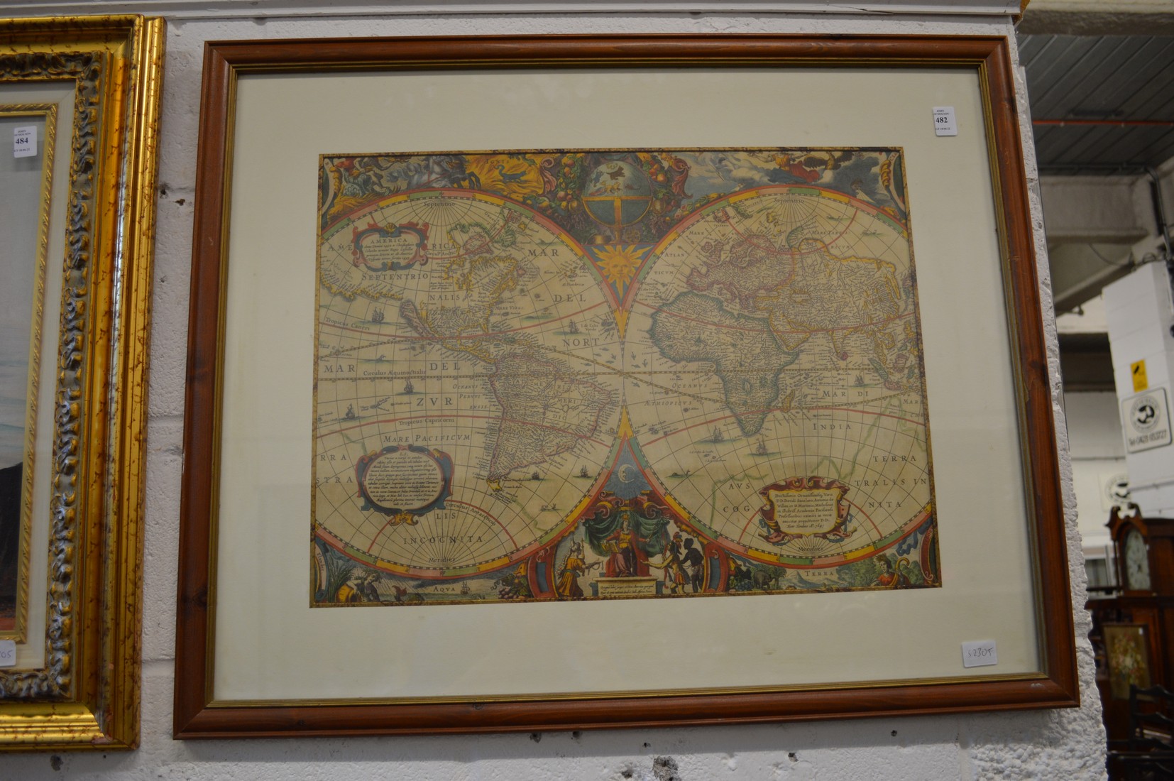 A coloured engraving depicting a map of the world, shown as two hemispheres.