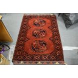 A Bokhara style Persian rug.