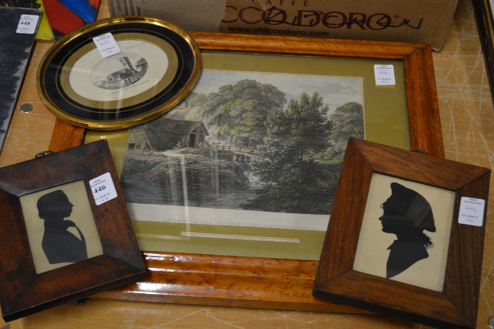 Two framed silhouettes and two engravings.