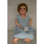 A Simon & Halbig porcelain headed doll.