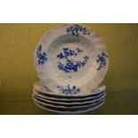 Six blue and white decorated dishes.
