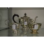 A decorative three piece tea service.