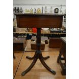 A 19th century mahogany pedestal occasional table with a drawer to one end.