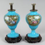 A GOOD PAIR OF 19TH CENTURY SEVRES BLUE GROUND LAMPS, painted with reverse panels of figures and