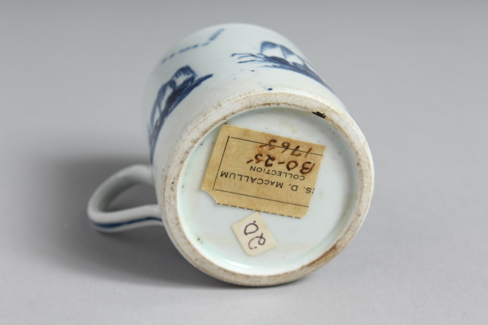 A BOW COFFEE CUP painted in underglaze blue with tall rocks and a bridge. - Image 6 of 6