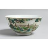 A CHINESE FAMILLE VERT CIRCULAR BOWL decorated with people. 6ins diameter.