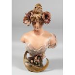 AN ART NOUVEAU POTTERY BUST. Head and shoulders of a young girl, flowers in her hair. Signed, Ed